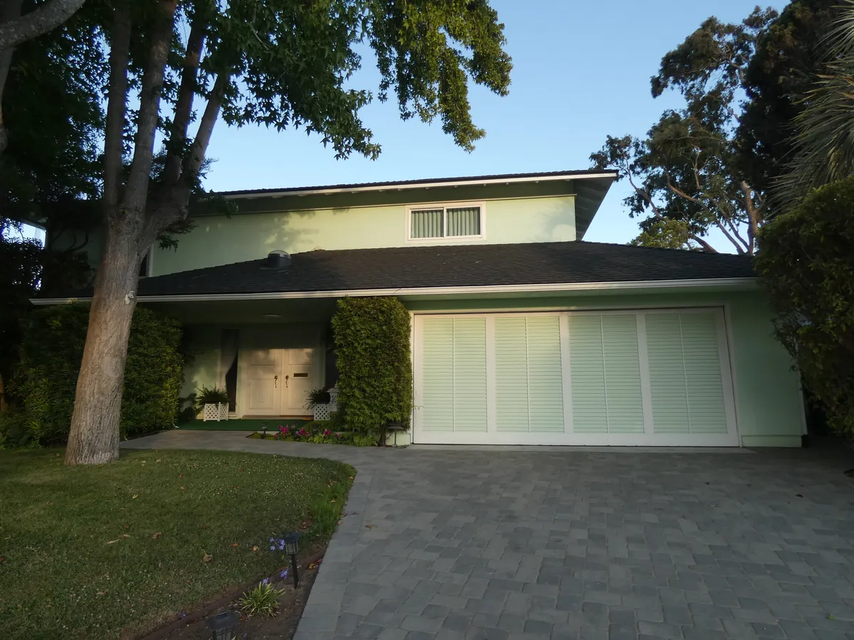 California home with a wide light-colored garage door